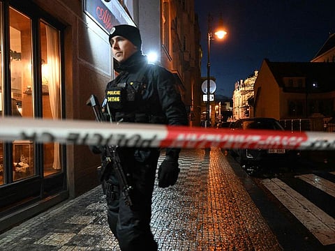 A police officer secures the area near the Charles University in central Prague, on December 21, 2023. A gunman killed 10 people and wounded dozens of others at a Prague university on December 21, 2023, before the police "eliminated" him, authorities said.