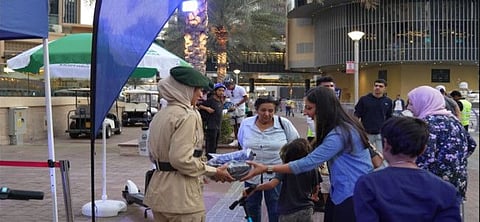 Empowering Commuters: Dubai Police and Roads and Transport Authority (RTA) collaborate to boost road safety with distribution of essential gear to cyclists and scooter users.