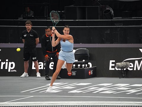 Aryna Sabalenka hitting a double-fisted backhand return during her win over world No 1 Iga Swiatek on Day 3 of the Meteora World Tennis League in Abu Dhabi on Saturday.