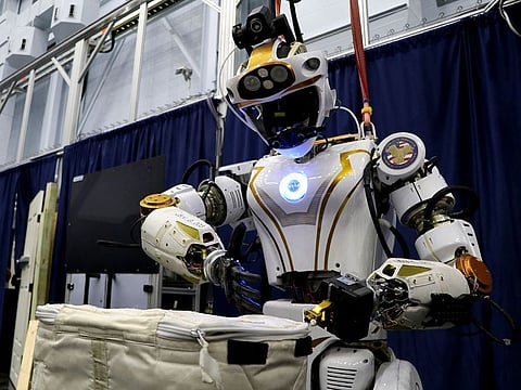 NASA's humanoid robot Valkyrie opens a bag at the Johnson Space Center in Houston, Texas, U.S., November 16, 2023.