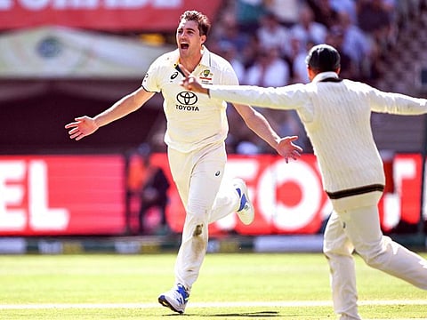 Australia's Pat Cummins celebrates dismissing Pakistan's batsman Barbar Azam on the second day of the second cricket Test match at the Melbourne Cricket Ground on Wednesday.