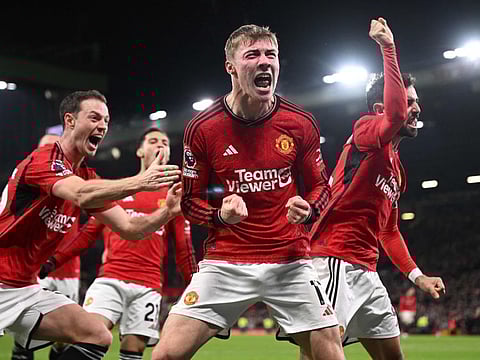 Manchester United's Danish striker Rasmus Hojlund (centre) celebrates with teammates after scoring their third goal during the English Premier League match against Aston Villa at Old Trafford in Manchester on Tuesday.