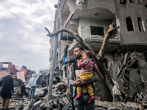 Palestinians inspect the remains of their homes destroyed by Israeli bombardment in Maghazi, central Gaza, on December 25, 2023. More than 20,000 people have been killed in Gaza since the start of the war. “There’s the darkness of parents in Gaza who know that to be a parent there these days means you are passing a death sentence on your children — a place where now the horrors inflicted on both parents and children.”