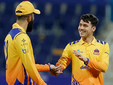 Muhammad Jawadullah congratulated by England all-rounder Moeen Ali during a match for Sharjah Warriors earlier this year.