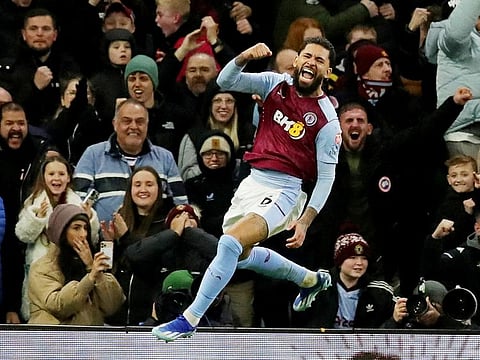 Aston Villa's Douglas Luiz celebrates scoring their third goal.