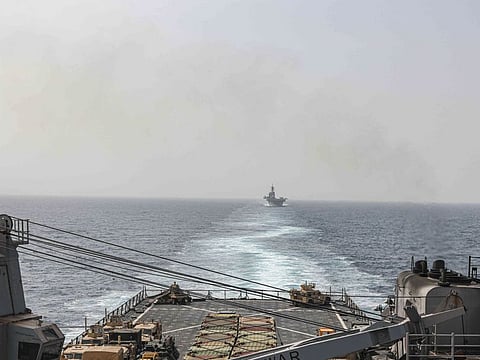 In this image provided by the US Navy, the amphibious dock landing ship USS Carter Hall and amphibious assault ship USS Bataan transit the Bab Al Mandab strait on August 9, 2023.   The Alborz warship entered the Red Sea via the Bab Al Mandab Strait, Tasnim said, without saying when. There were unconfirmed reports on social media it arrived late on Saturday.