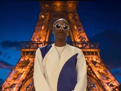 Snoop can be seen dancing in front of the Eiffel Tower to rap music in a social media post.