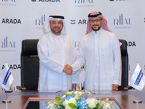 Abdulla Qassem, Chairman of Rital Properties (left) and Prince Khaled bin Alwaleed bin Talal, Vice Chairman of Arada sign the agreement at the EmiratesNBD headquarters in Dubai