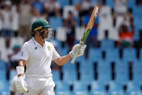 South Africa's Dean Elgar celebrates after scoring 150 runs during the third day of the first Test against India at SuperSport Park in Centurion on December 28, 2023.