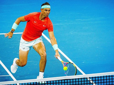 Spain's Rafael Nadal hits a return against Austria's Dominic Thiem during their men's singles match at the Brisbane International on Tuesday.