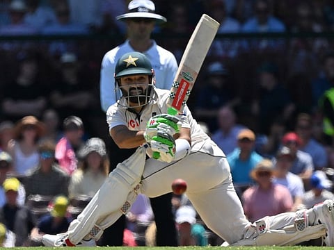 Pakistan's Mohammad Rizwan sweeps one to the fence during the first day of the third cricket Test against Australia at the Sydney Cricket Ground on Wednesday.