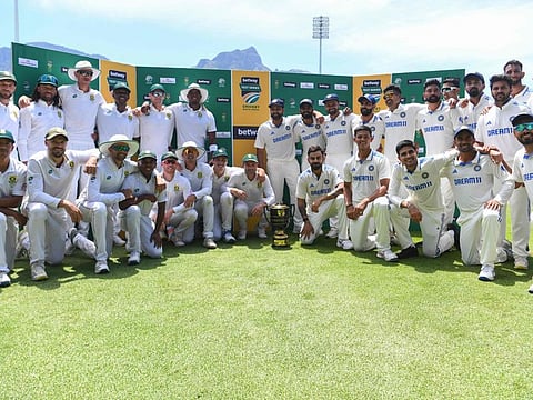 South Africa (left) and India players pose with the trophy after drawing the series at Newlands stadium in Cape Town on Thursday.
