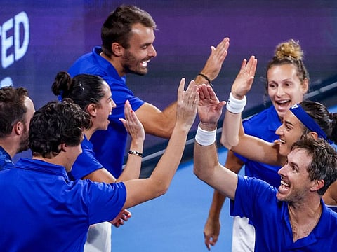 France's Caroline Garcia and Edouard Roger-Vasselin (right) celebrate with teammates after defeating Norway's Casper Ruud and Ulrikke Eikeri during their mixed doubles match at the United Cup in Sydney on Thursday.