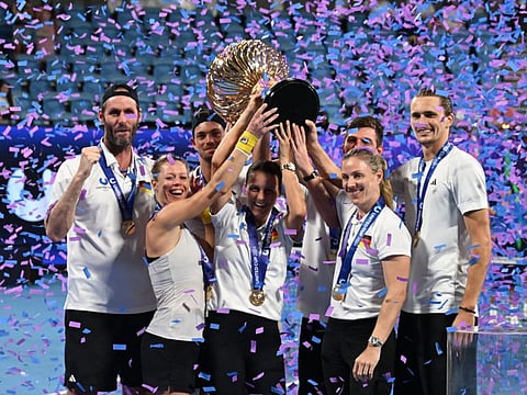 Team captain Torben Beltz and his players Alexander Zverev, Angelique Kerber, Maximilian Marterer, Kai Wehnelt, Tatjana Maria and Laura Siegemund celebrate with the trophy after Germany win the United Cup at Ken Rosewall Arena in Sydney on Sunday.