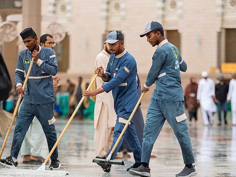 Workers cleaning the Grand Mosque in Medina.