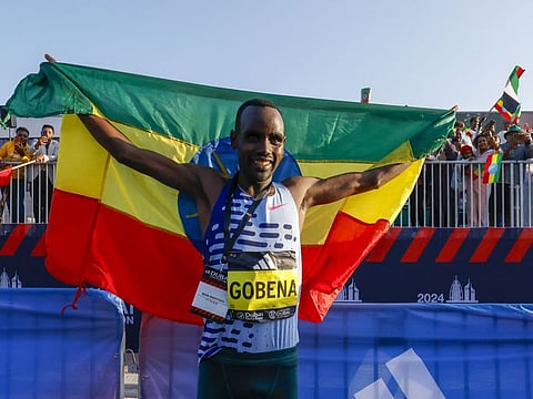 Debutant teenager Addisu Gobena shocked the men's field in 2:05:01 to clinch the Dubai Marathon on Sunday.