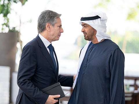 Sheikh Mohamed Bin Zayed Al Nahyan (R) bids farewell to Antony Blinken after a meeting at Al Shati Palace in Abu Dhabi on Monday