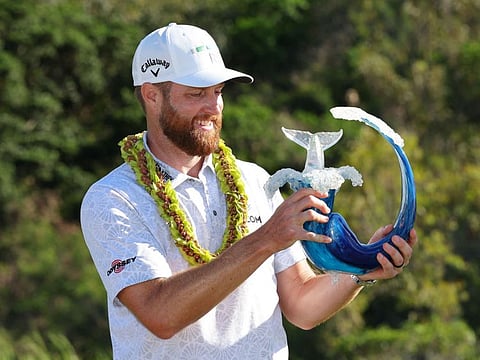 Chris Kirk of the US celebrates with the trophy after winning the USPGA Tour Sentry at Kapalua Golf Club on Sunday.