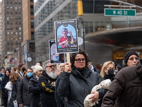 People participate in a silent march and protest in midtown Manhattan against the deaths of Palestinians in Gaza