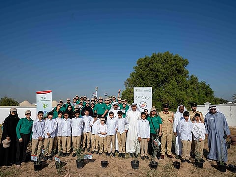 Dubai Duty Free employees along with officials from Dubai Police Academy, Zayed Intl Foundation for the Environment and students of Hemaya School