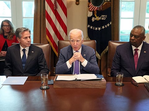 Biden, flanked by Secretary of State Antony Blinken and Secretary of Defence Lloyd Austin, makes a statement to the news media ahead of a cabinet meeting at the White House in Washington.