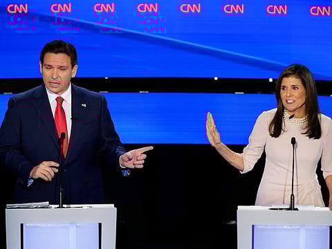 Former UN Ambassador Nikki Haley, right, and Florida Gov. Ron DeSantis, left, both speaking at the CNN Republican presidential debate at Drake University in Des Moines, Iowa, Wednesday, Jan. 10, 2024. (AP Photo/Andrew Harnik)