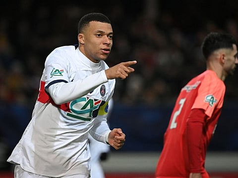 Paris Saint-Germain's Kylian Mbappe gestures after scoring his team's fifth goal during the French Cup against US Revel on Sunday.
