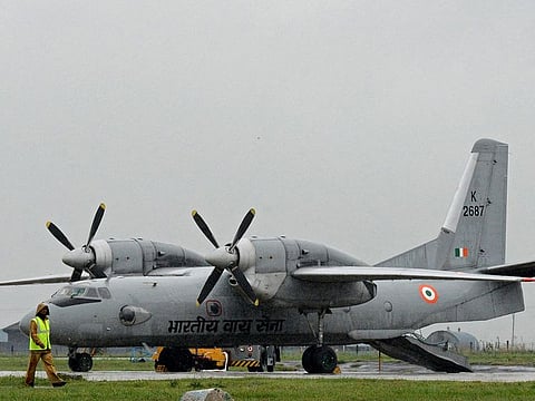 An Indian Air Force Antonov An-32 transport aircraft is pictured as rain falls at an air force base in Srinagar on September 6, 2014.