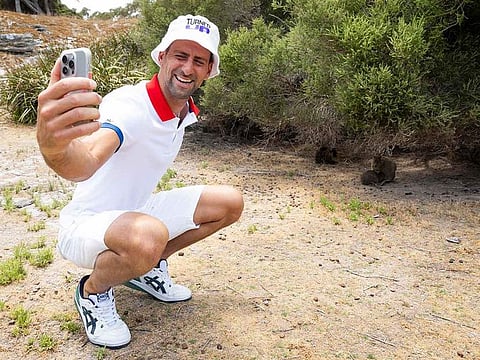 File photo: A handout photo taken on December 29, 2023 and released on December 30 by Tennis Australia shows Serbia's Novak Djokovic taking a selfie with quokka on Rottnest Island