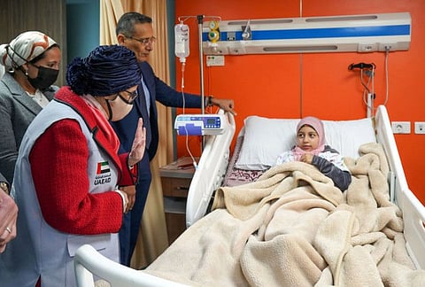Sheikha Jawaher bint Mohammed Al Qasimi interacts with a young patient at the facility