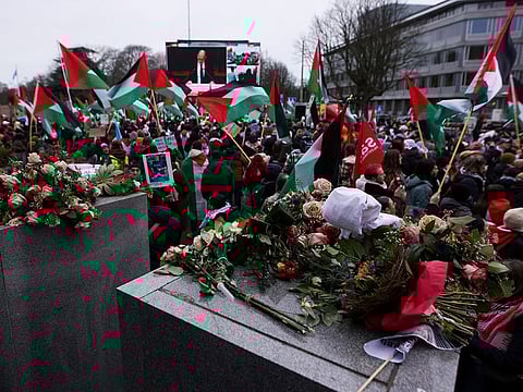 Pro-Palestinian protesters gather near the International Court of Justice (ICJ) as judges hear a request for emergency measures by South Africa to order Israel to stop its military actions in Gaza, in The Hague, Netherlands