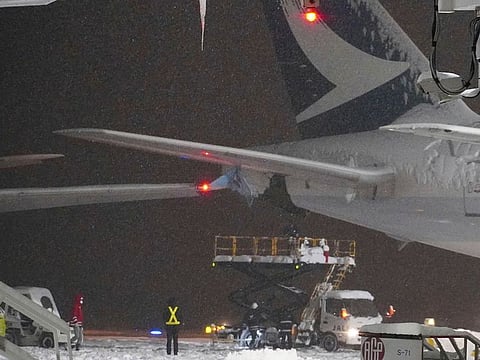 A Korean Air plane carrying 289 people hit a parked Cathay Pacific aircraft while being pushed by a ground vehicle ahead of takeoff at northern Japan's New Chitose Airport on Tuesday but caused no fire or injuries, fire and airline officials said.