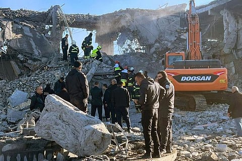 Firemen and security staff inspect the rubble of a building at a site hit by a missile attack launched by Iran's Islamic Revolutionary Guard Corps (IRGC), in Arbil, the capital of Iraq's northern autonomous Kurdish region on January 16, 2024.
