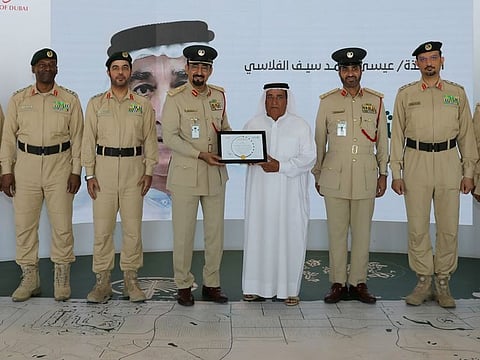 Issa Muhammad Al Falasi (3rd R) is a father for four daughters and two sons. He was worked in the sea since he was seven.