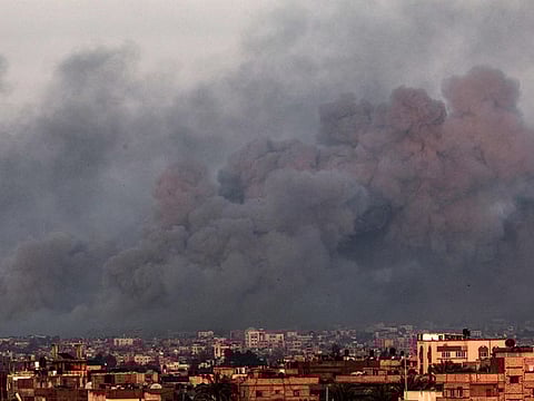 This picture taken from Rafah shows smoke billowing over Khan Younis in the southern Gaza Strip during Israeli bombardment on January 16, 2024.
