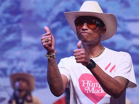 US rapper, artist and fashion designer Pharrell Williams acknowledges applause after presenting creations for the Louis Vuitton Menswear Ready-to-wear Fall-Winter 2024/2025 collection as part of the Paris Fashion Week., in Paris on January 16, 2024.
