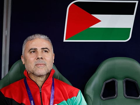 Palestine's coach Makram Daboub looks on before the start of the Qatar 2023 AFC Asian Cup Group C match against Iran.