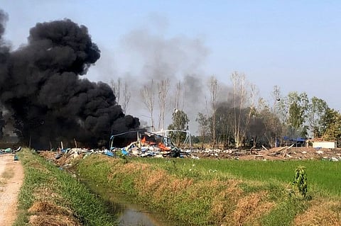 This handout from the Novice Kaew Suphanburi Highway Rescue Association taken and released on January 17, 2024 shows smoke rising after an explosion at a fireworks factory near Sala Khao township in Thailand's Suphan Buri province.