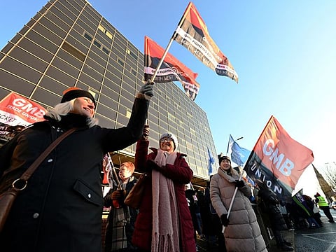 NHS workers picket outside Mater Hospital during a major strike of around 170,000 public sector workers over the freezing of pay increases due to a breakdown of the region's power-sharing government, in Belfast, Northern Ireland, January 18, 2024.