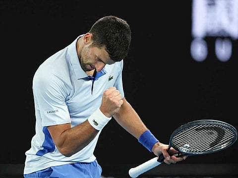 Serbia's Novak Djokovic reacts after a point against France's Adrian Mannarino during their men's singles match on day eight of the Australian Open tennis tournament in Melbourne on January 21, 2024.