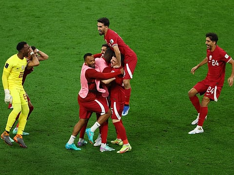 Qatar's Hassan Al Haydos celebrates scoring their first goal with teammates during the AFC Asian Cup Group A match against China at the Khalifa International Stadium, Al Rayyan, Qatar on Monday.