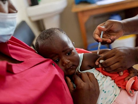 A nurse administers the malaria vaccine to an infant at the Lumumba Sub-County hospital in Kisumu, Kenya.