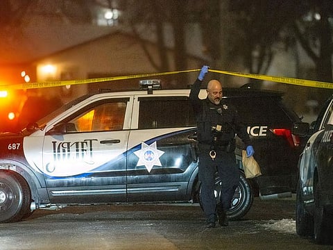 Police work a scene, Monday, Jan. 22, 2024, in Joliet, Ill., after multiple people were shot and killed over two days at three locations in the Chicago suburbs.