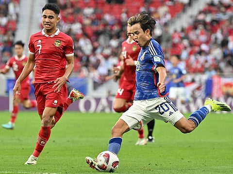 Japan's midfielder Takefusa Kubo kicks the ball during the Qatar 2023 AFC Asian Cup Group D match against Indonesia at Al Thumama Stadium in Doha on Wednesday.