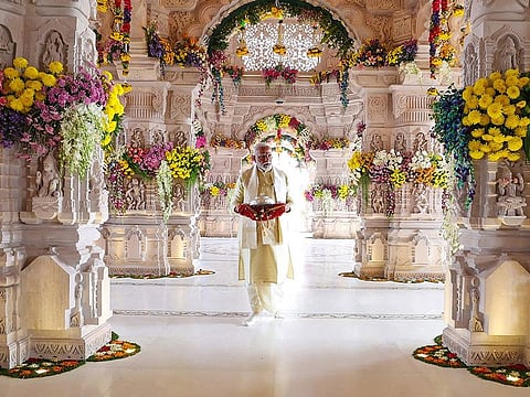India's Prime Minister Narendra Modi walks into the Ram temple to officially consecrate the temple in Ayodhya in India's Uttar Pradesh state. Modi inaugurated the temple on January 22 .
