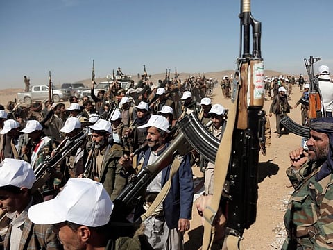 Al Houthi militants march during a rally of support for the Palestinians in the Gaza Strip and against the US strikes on Yemen outside Sana'a.