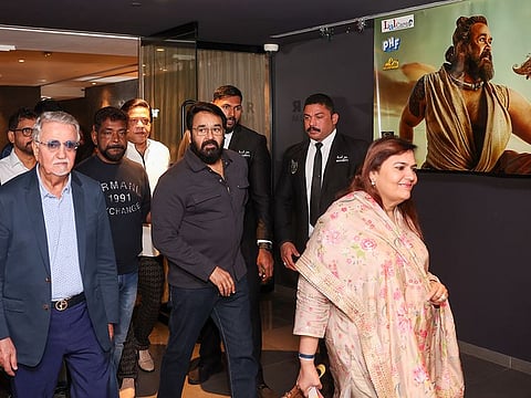 Malayalam superstar Mohanlal, his wife Suchitra Mohanlal, and UAE distributor Ahmad Golchin of Phars Film at the preview of Malaikottai Vaaliban in Dubai