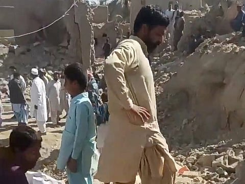 People inspect the rubble in the aftermath of Pakistan's military strike on an Iranian village near Saravan on January 18, 2024.