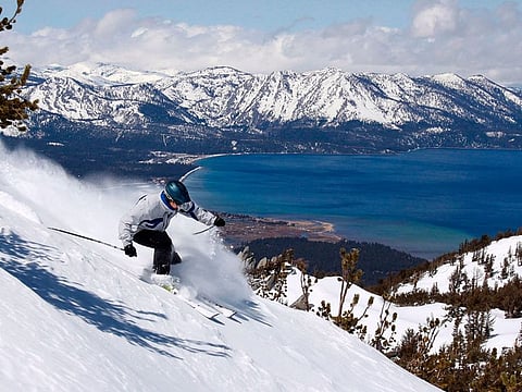 A skier kicks up some powder at Heavenly Ski Resort, in South Lake Tahoe, California.