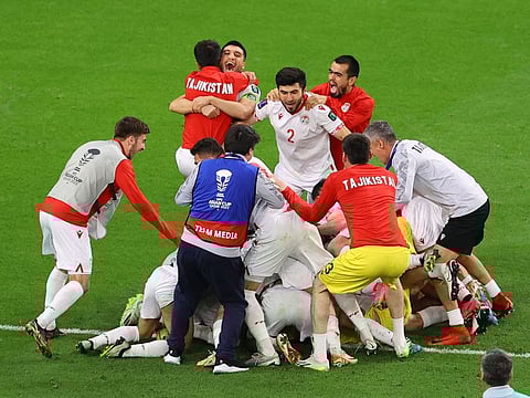 Tajikistan players celebrate after winning the penalty shootout during the AFC Asian Cup Round of 16 match against UAE at the Ahmad Bin Ali Stadium, Al Rayyan, Qatar on Sunday.
